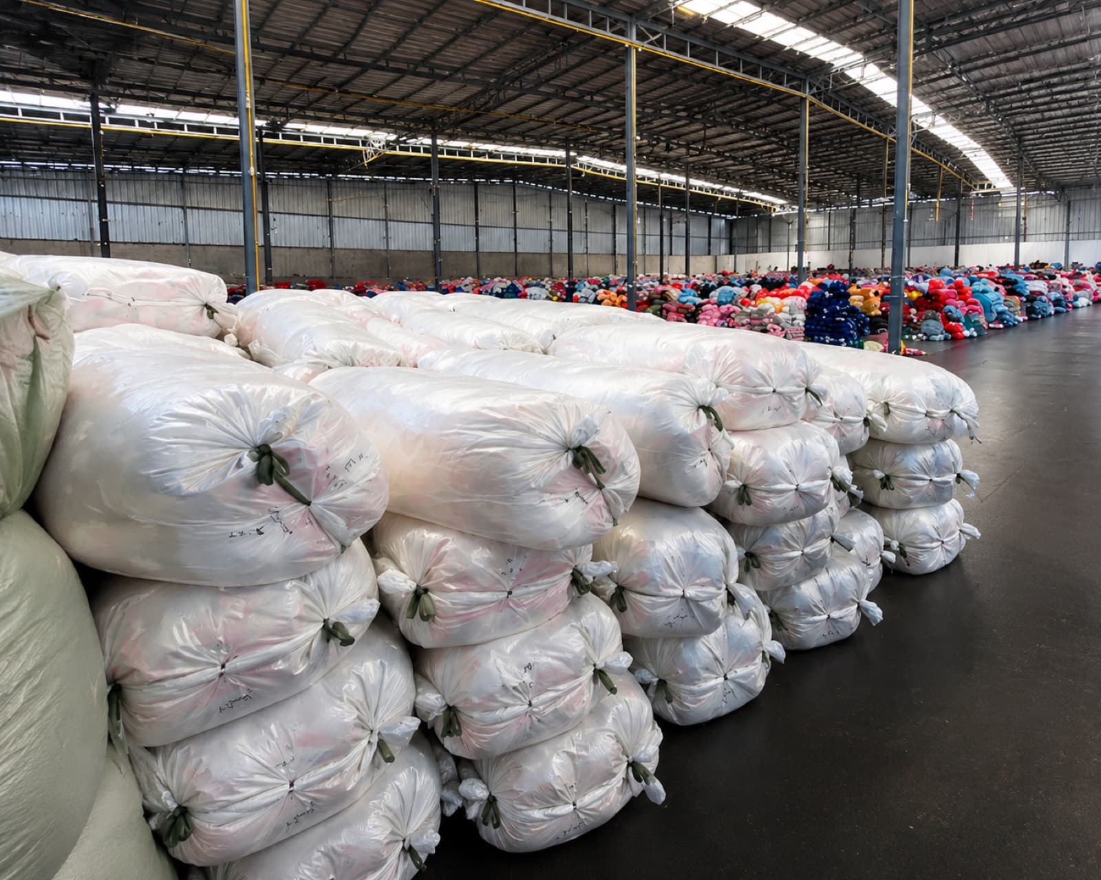 Rows of bulk wholesale bedding stock in the warehouse